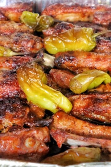 Smoked Mississippi-style ribs garnished with pepperoncini peppers.