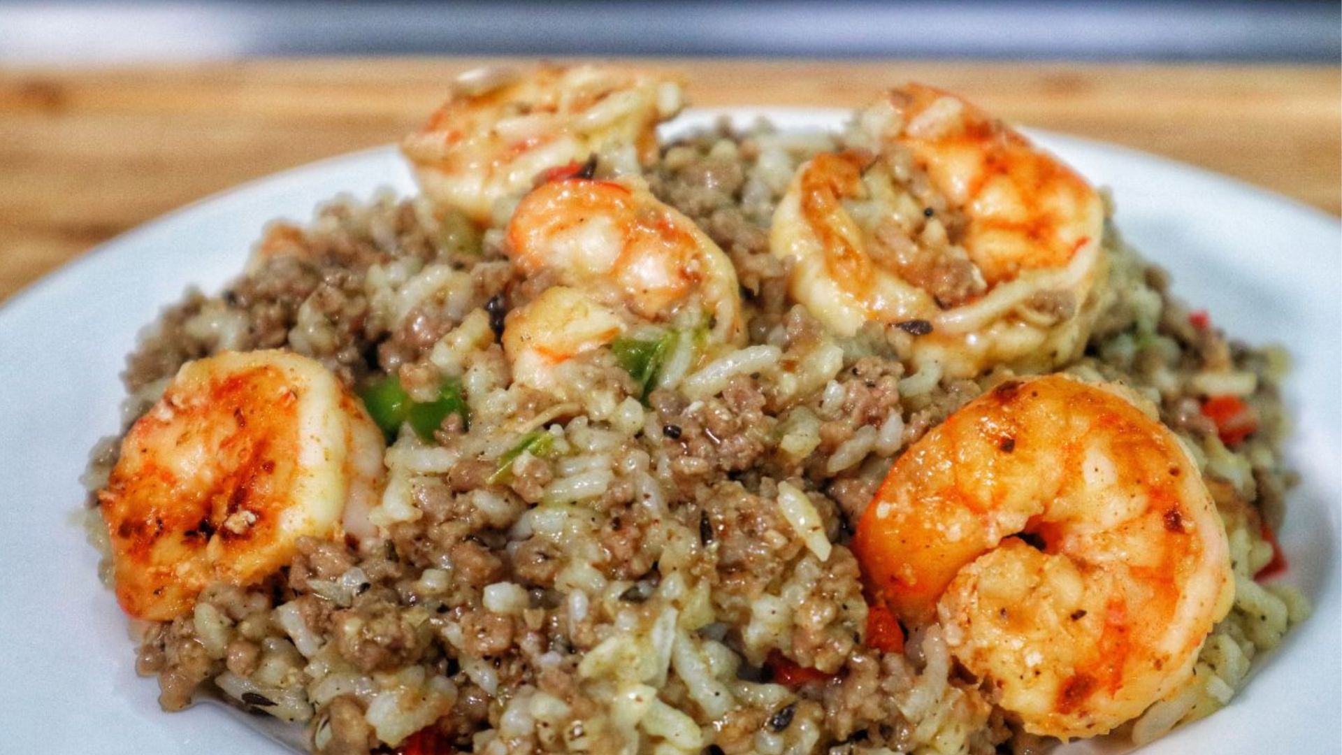 Shrimp dirty rice made with ground meat, tender rice, and sautéed shrimp, a flavorful twist on the classic dirty rice recipe.