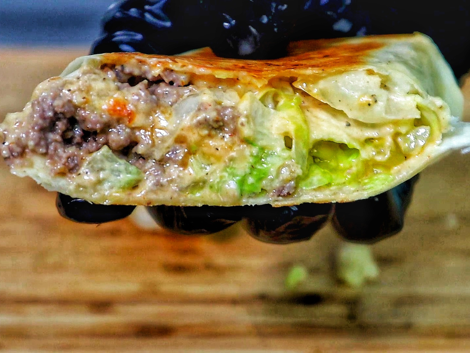 A stack of Big Mac wraps, sliced in half to show the inside.