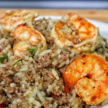 Shrimp dirty rice made with ground meat, tender rice, and sautéed shrimp, a flavorful twist on the classic dirty rice recipe.