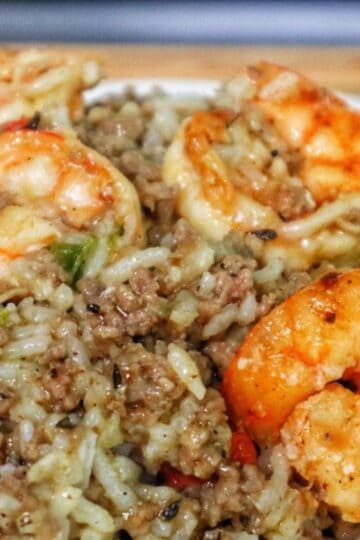 Shrimp dirty rice made with ground meat, tender rice, and sautéed shrimp, a flavorful twist on the classic dirty rice recipe.