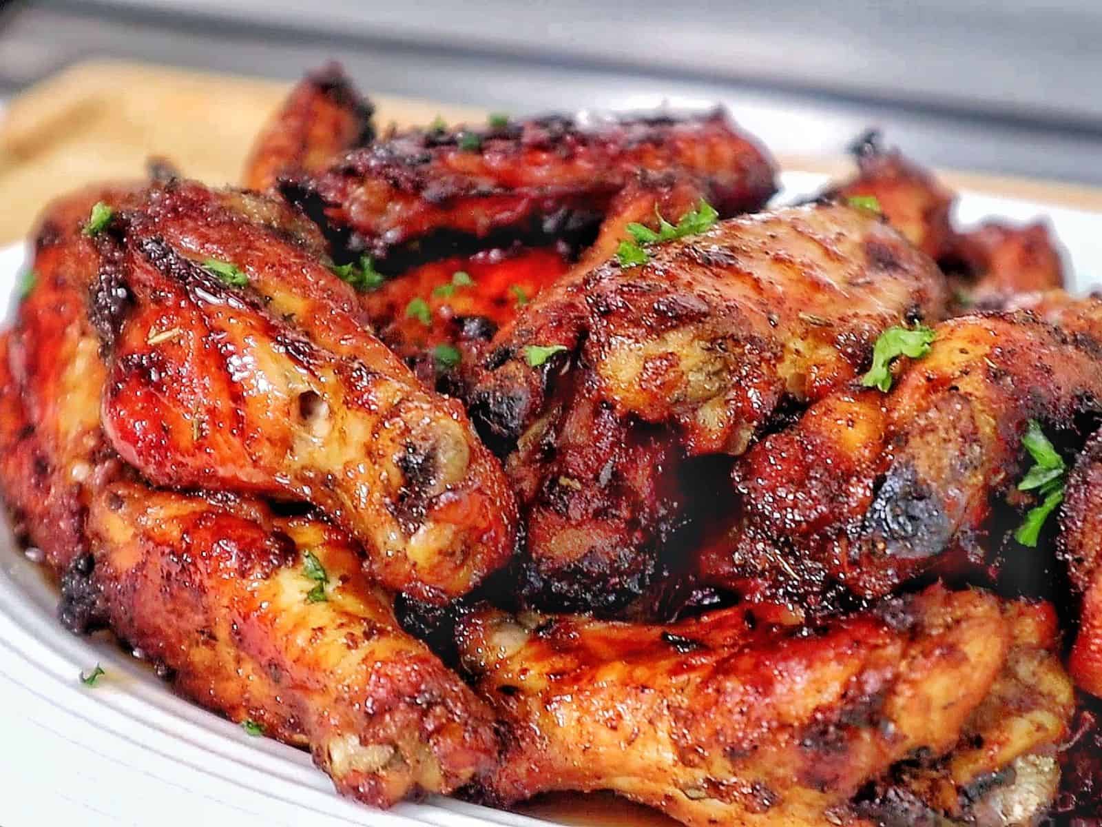 Crispy, golden-brown Cajun chicken wings, glazed with a sweet and smoky brown sugar seasoning and garnished with fresh parsley