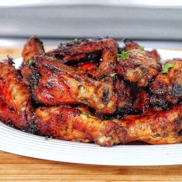 Crispy, golden-brown Cajun chicken wings, glazed with a sweet and smoky brown sugar seasoning and garnished with fresh parsley