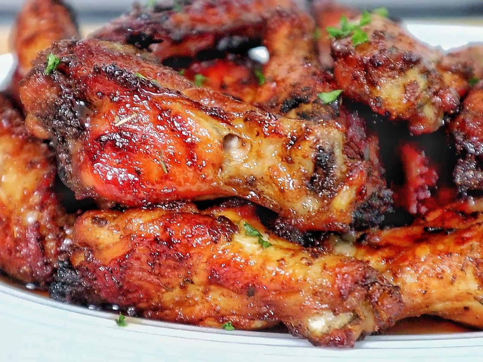 Crispy, golden-brown Cajun chicken wings, glazed with a sweet and smoky brown sugar seasoning and garnished with fresh parsley