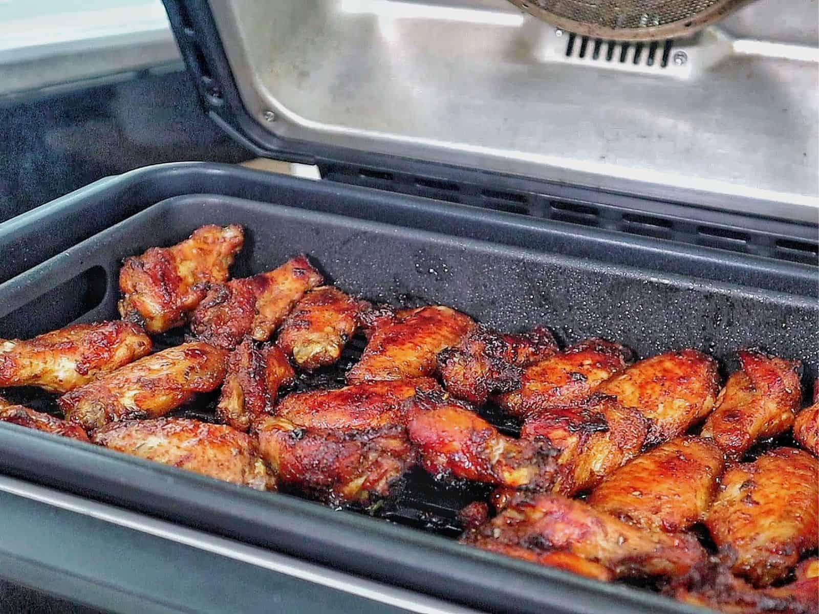 Crispy, golden-brown Cajun chicken wings, glazed with a sweet and smoky brown sugar seasoning and garnished with fresh parsley