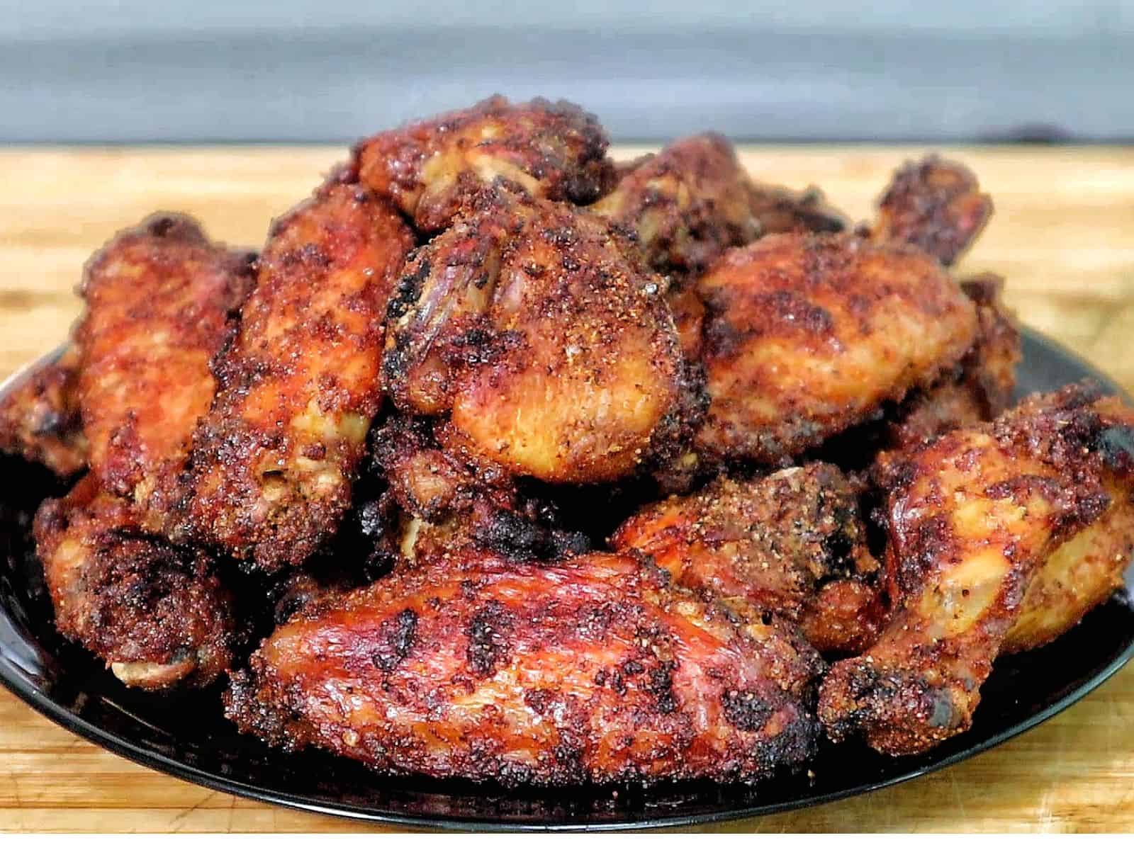 crispy dry rub chicken wings, golden-brown with a perfectly seasoned crust.