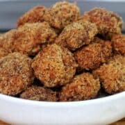 Golden, crispy Spicy Fried Mushrooms piled high, showing their crunchy coating and perfectly fried texture.