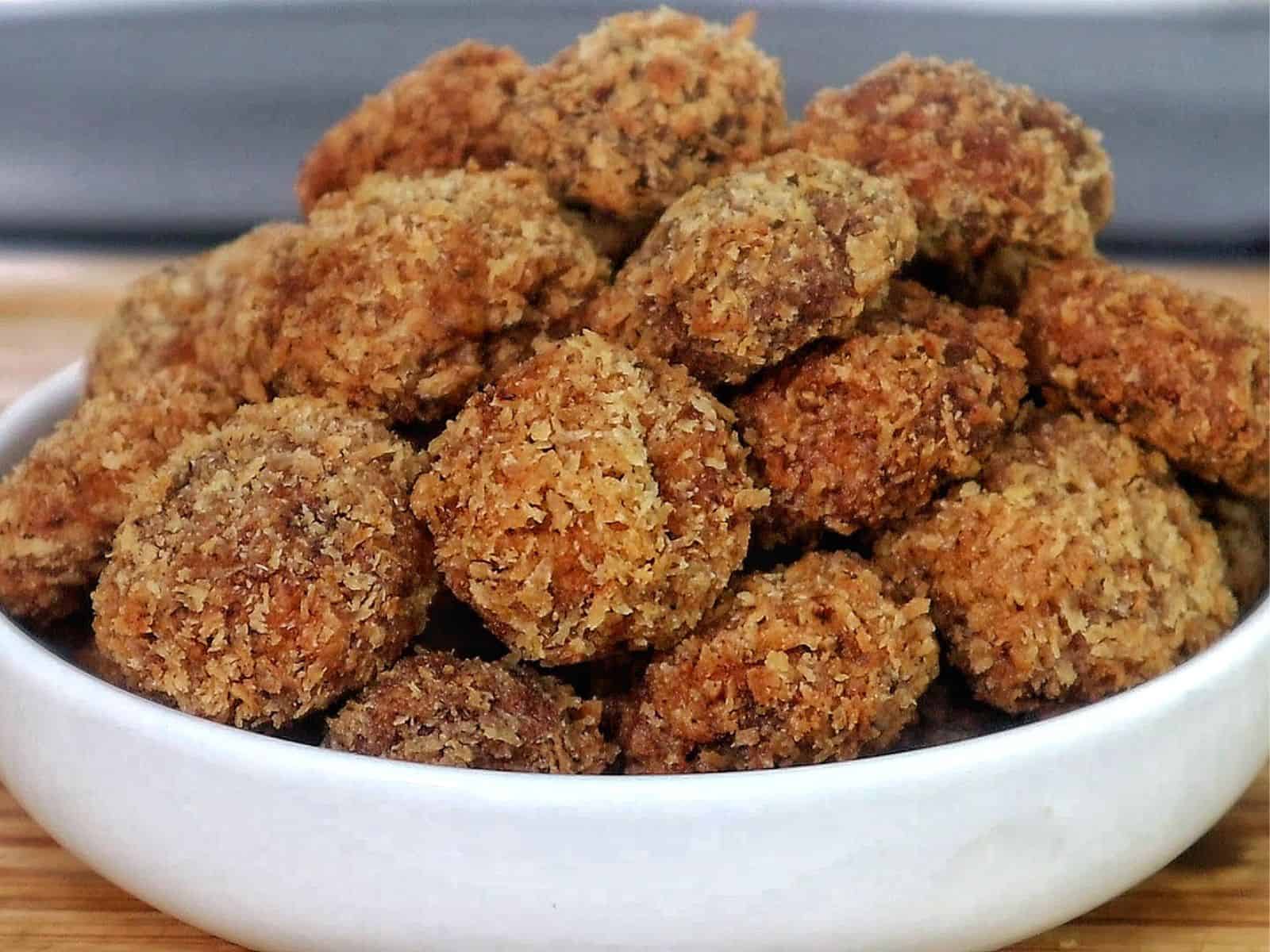 Golden, crispy Spicy Fried Mushrooms piled high, showing their crunchy coating and perfectly fried texture.