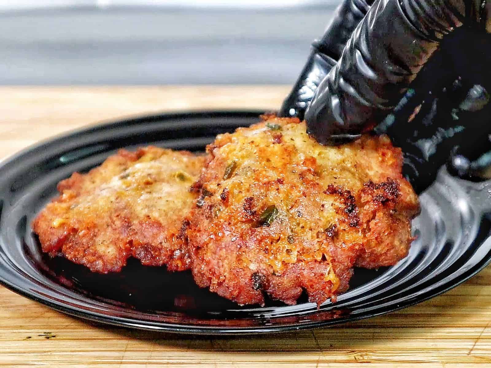 golden brown cheesy chicken fritters with crispy edges, juicy texture, and melted cheese glistening on the surface