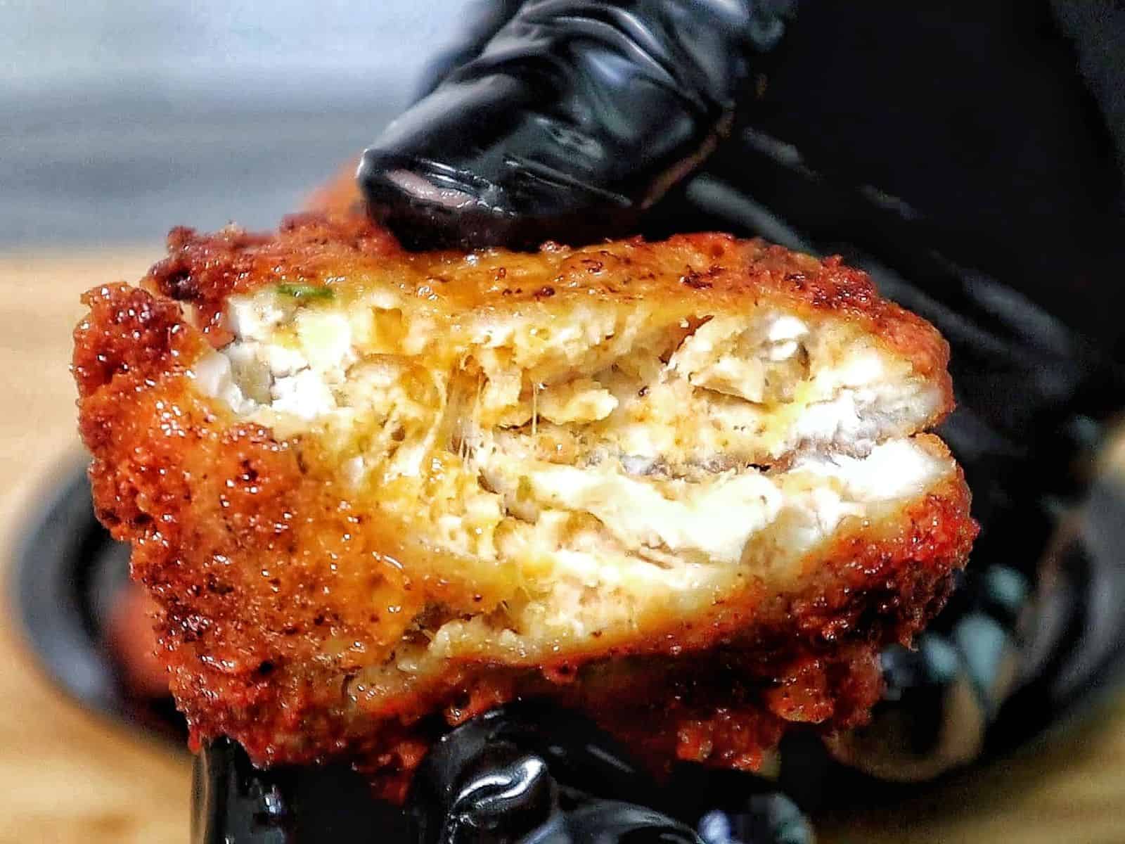 golden brown cheesy chicken fritters with crispy edges, juicy texture, and melted cheese glistening on the surface