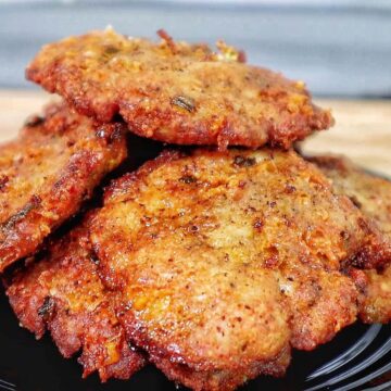 golden brown cheesy chicken fritters with crispy edges, juicy texture, and melted cheese glistening on the surface