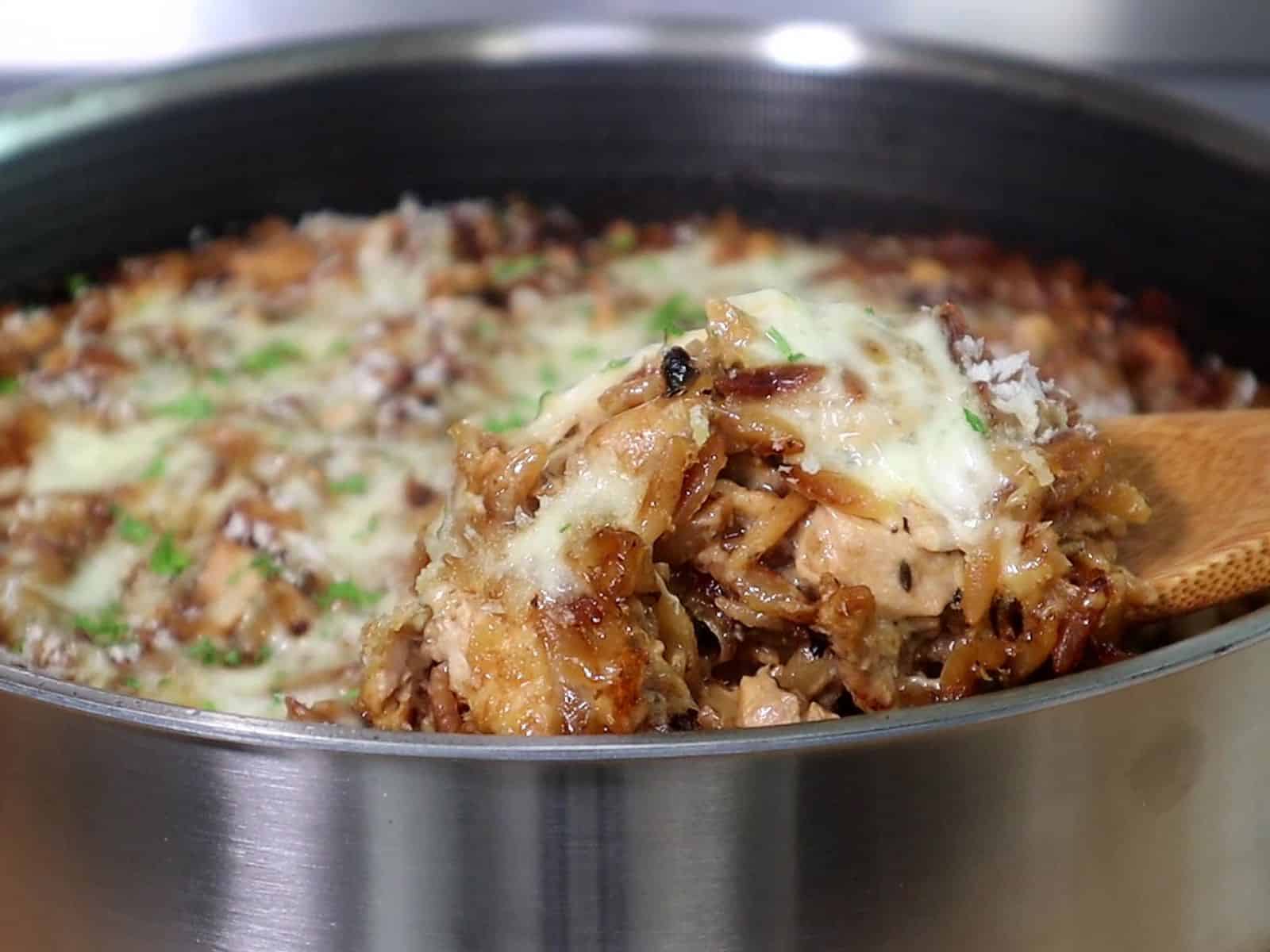 Golden, cheesy French onion chicken casserole made with orzo pasta, caramelized onions, shredded chicken, and melted mozzarella