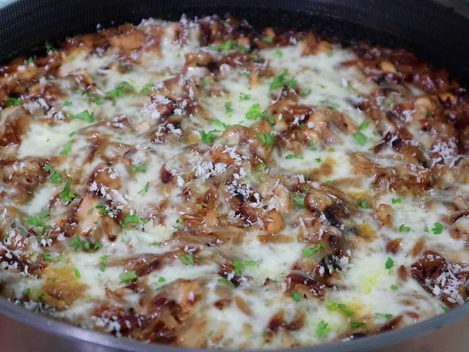 Golden, cheesy French onion chicken casserole made with orzo pasta, caramelized onions, shredded chicken, and melted mozzarella