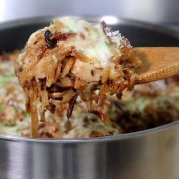 Golden, cheesy French onion chicken casserole made with orzo pasta, caramelized onions, shredded chicken, and melted mozzarella