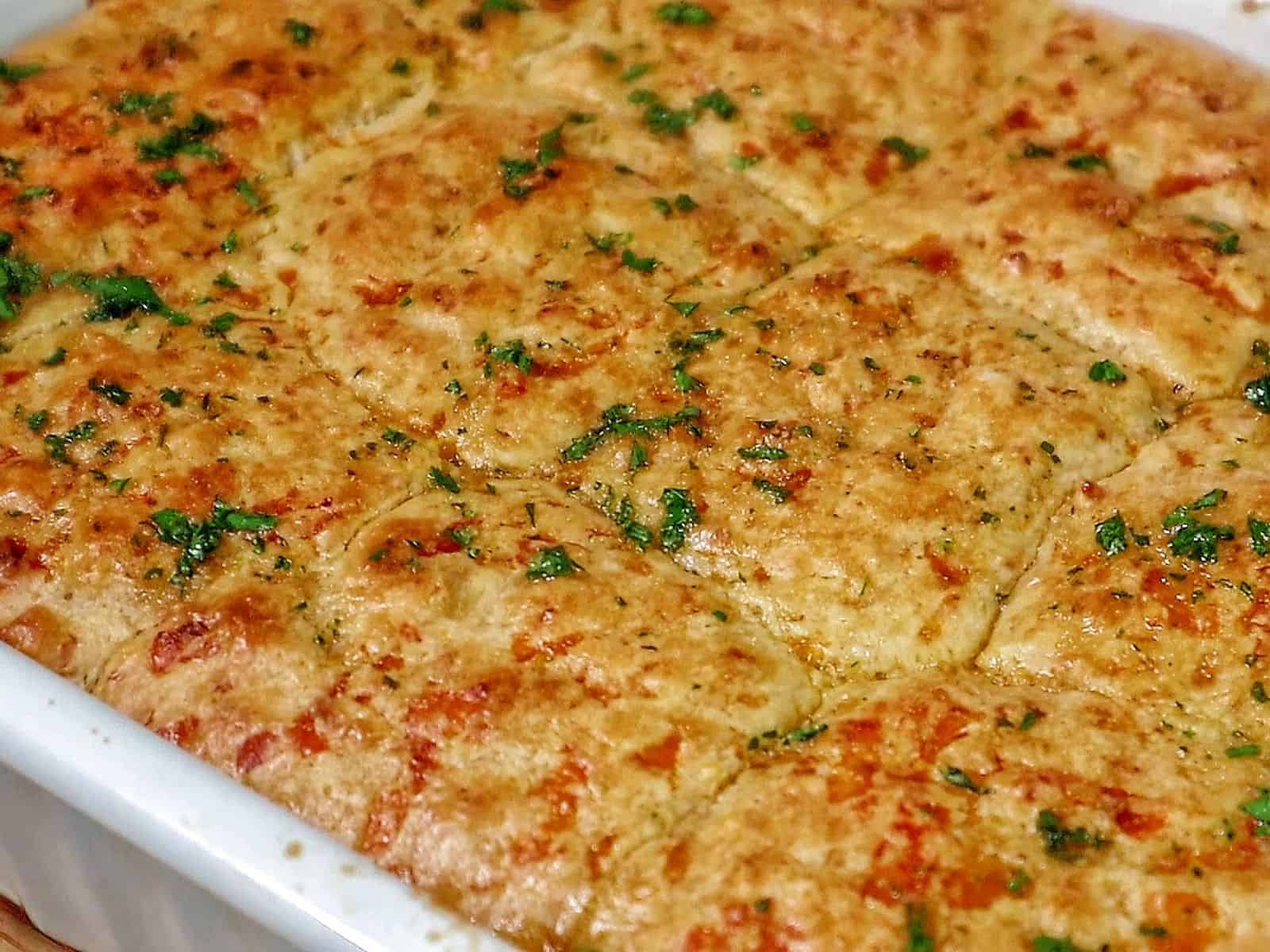 Cheddar Bay beef cobbler with a golden biscuit topping, layered over a creamy ground beef and vegetable filling.