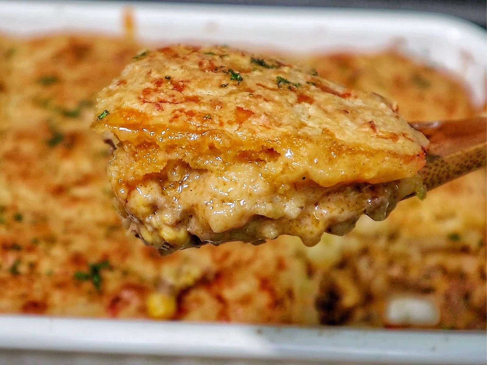 Cheddar Bay beef cobbler with a golden biscuit topping, layered over a creamy ground beef and vegetable filling.