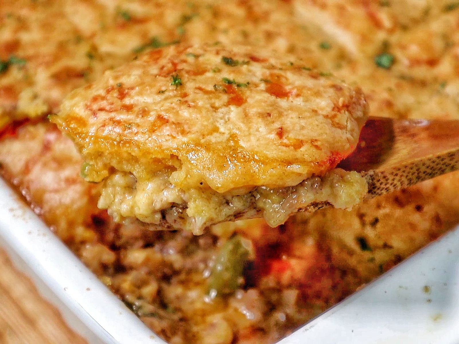 Cheddar Bay beef cobbler with a golden biscuit topping, layered over a creamy ground beef and vegetable filling.