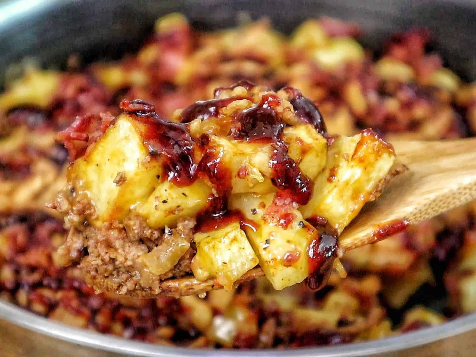 BBQ Cheeseburger Potato Skillet loaded with crispy potatoes, seasoned ground beef, melted Colby Jack cheese, bacon crumbles, crispy fried onions, and drizzled BBQ sauce