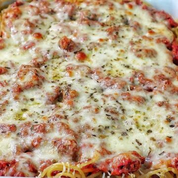 Cheesy baked Chicago Style Spaghetti layered with meat sauce, spaghetti noodles, melted mozzarella, and parmesan cheese.