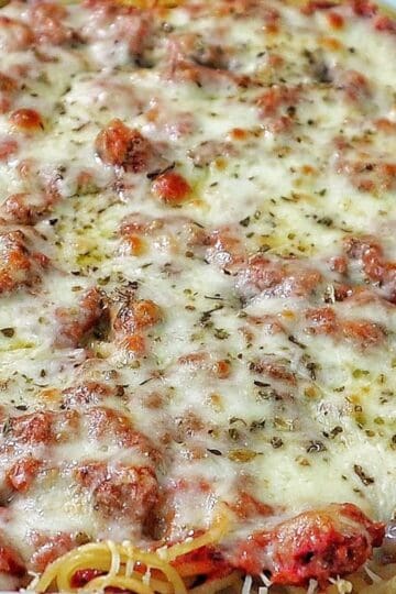 Cheesy baked Chicago Style Spaghetti layered with meat sauce, spaghetti noodles, melted mozzarella, and parmesan cheese.