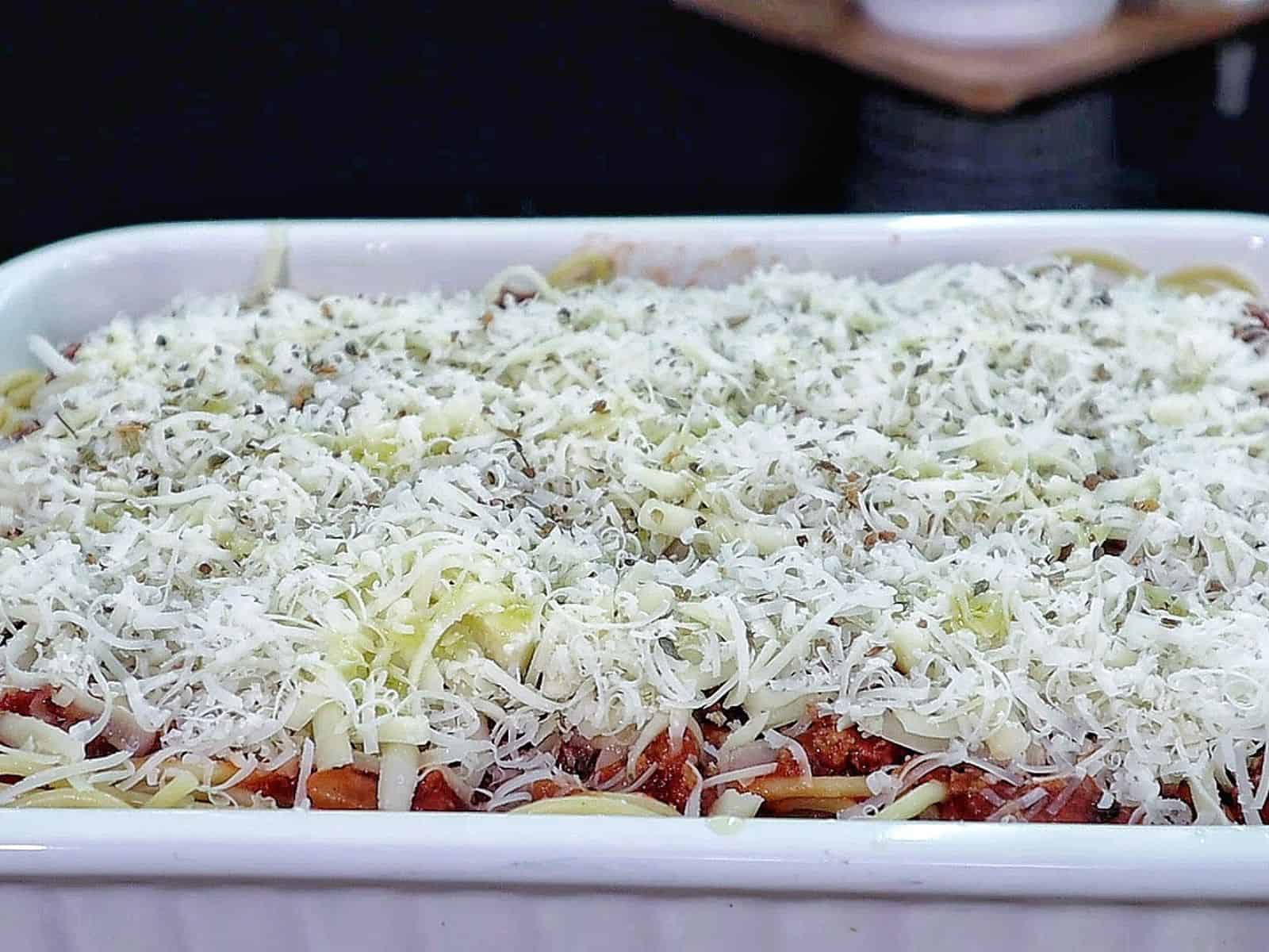 Cheesy baked Chicago Style Spaghetti layered with meat sauce, spaghetti noodles, melted mozzarella, and parmesan cheese.