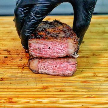 Perfectly grilled sirloin steak sliced medium-rare with a juicy pink center.