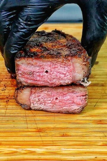 Perfectly grilled sirloin steak sliced medium-rare with a juicy pink center.