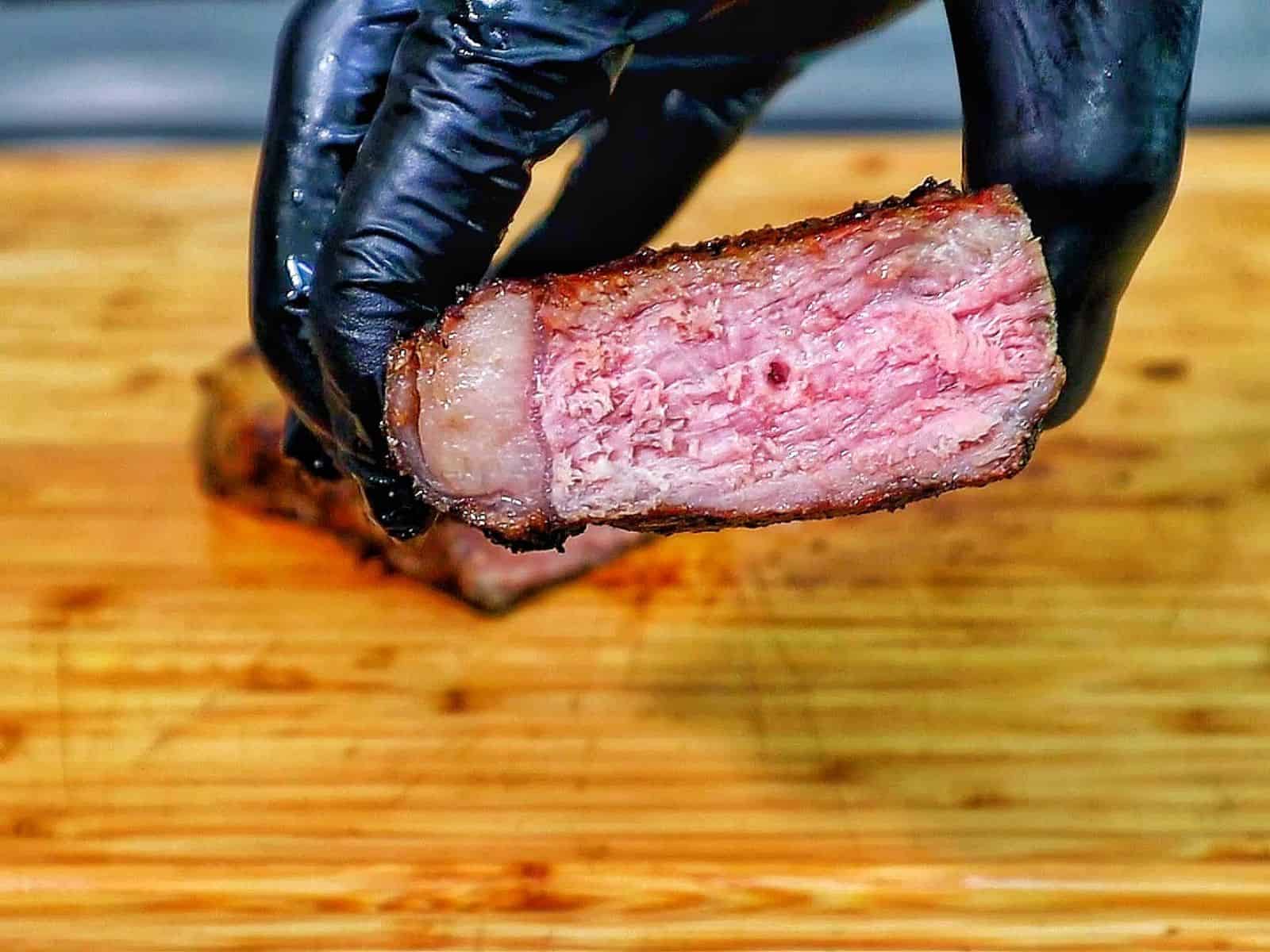 Perfectly grilled sirloin steak sliced medium-rare with a juicy pink center.