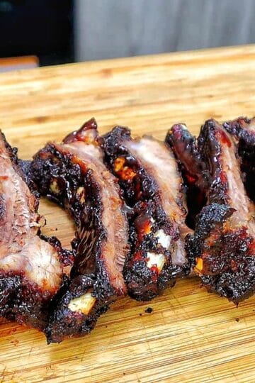 air fryer baby back ribs coated in a dark caramelized BBQ glaze