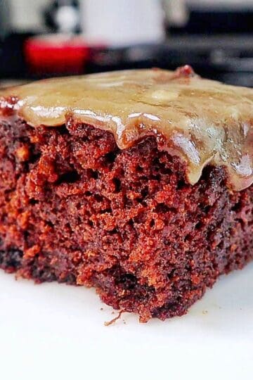 A rich chocolate banana bread brownie topped with a brown butter glaze, sliced into thick squares with a moist and fudgy center.