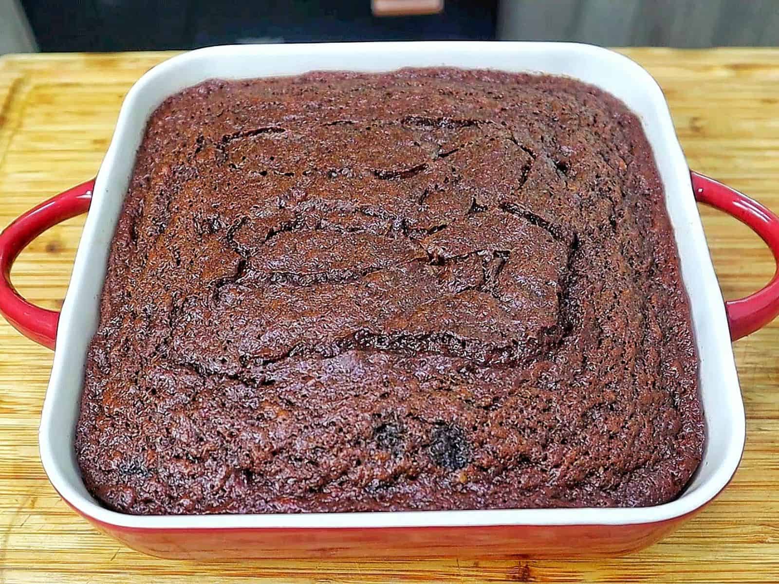 A rich chocolate banana bread brownie topped with a brown butter glaze, sliced into thick squares with a moist and fudgy center.