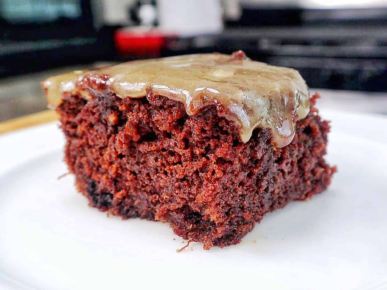 A rich chocolate banana bread brownie topped with a brown butter glaze, sliced into thick squares with a moist and fudgy center.