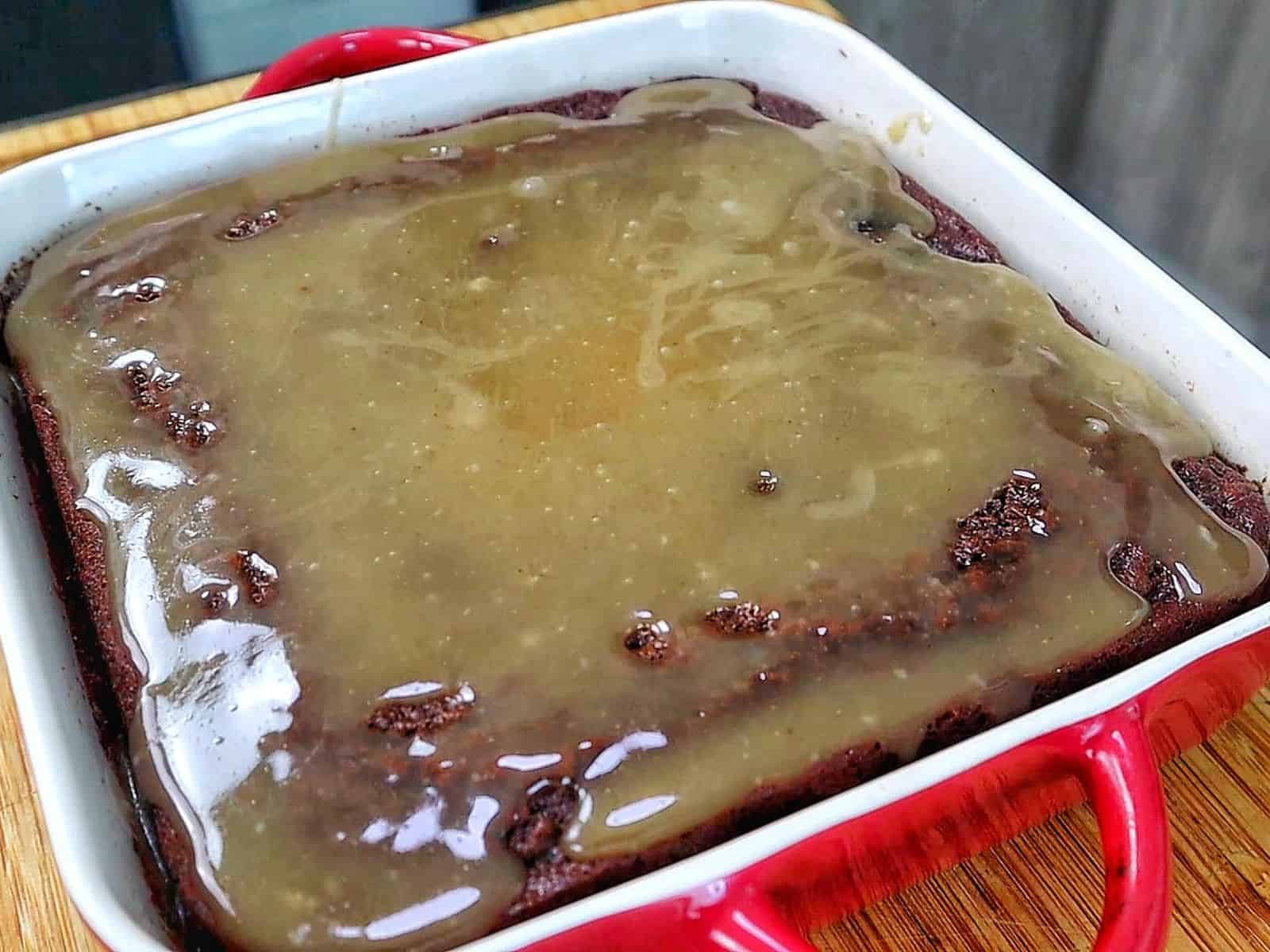 A rich chocolate banana bread brownie topped with a brown butter glaze, sliced into thick squares with a moist and fudgy center.