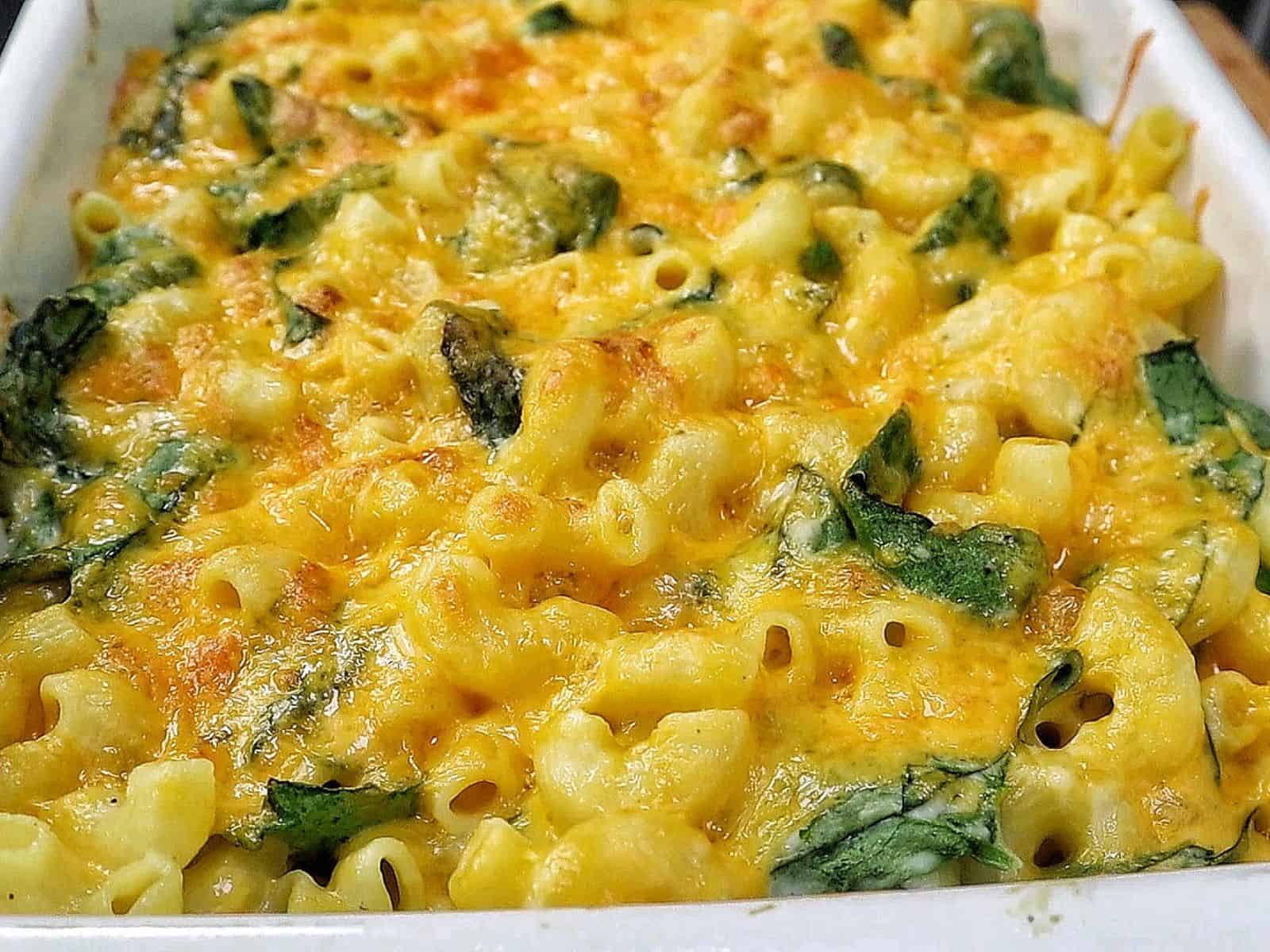 creamy homemade macaroni and cheese made with elbow pasta, fresh spinach, and a rich blend of cheddar, mozzarella, Parmesan, and cream cheese.
