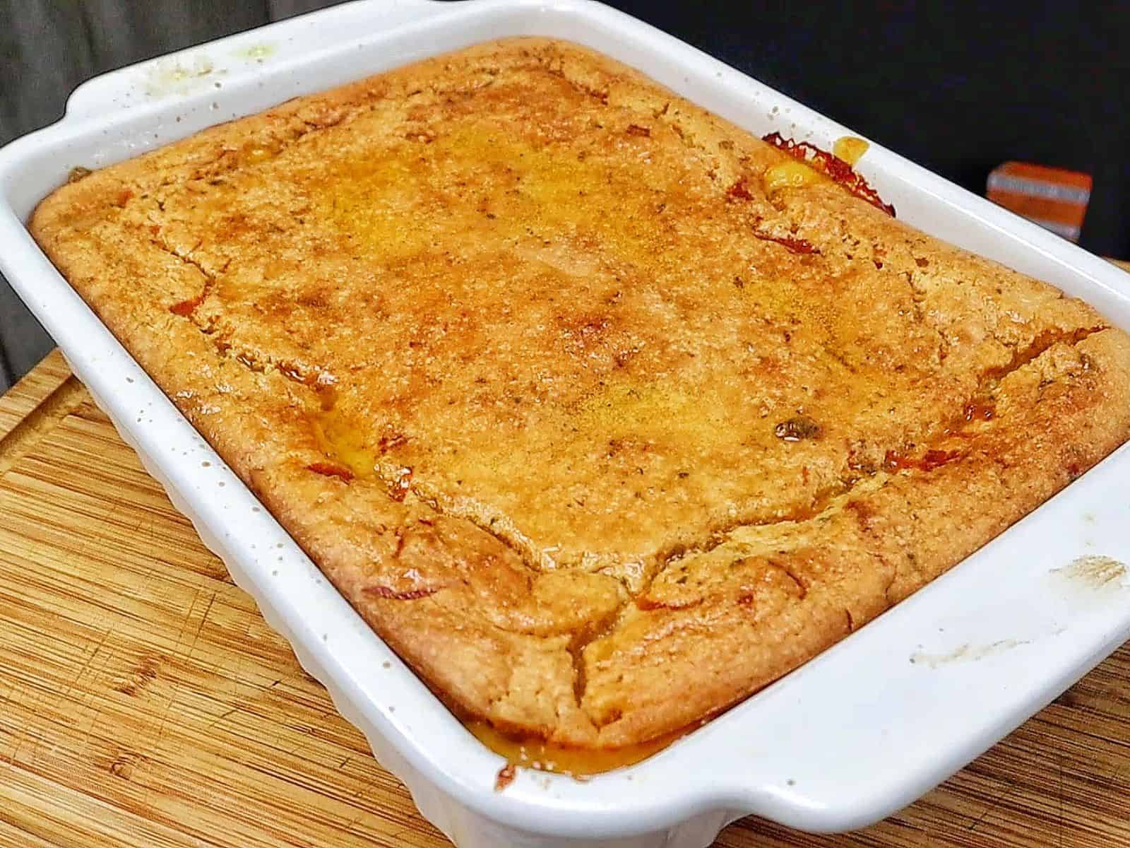 Philly Cheesesteak Cheddar Bay Cobbler topped with golden Cheddar Bay biscuit crust, filled with chopped roast beef, onions, bell peppers, and creamy cheddar cheese sauce.