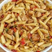 Creamy chicken fajita pasta with penne, seasoned chicken breast, red and green bell peppers, onions and tomatoes tossed in a flavorful creamy fajita sauce.