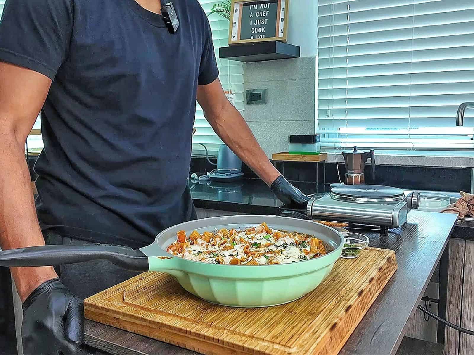 Cheesy Chicken Parmesan Pasta made with rigatoni, seasoned chicken, marinara sauce, melted mozzarella and Parmesan cheese, finished with fresh basil and Italian herbs.