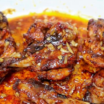 Butterflied chicken drumsticks coated in a glossy sweet chili garlic sauce with minced garlic, soy sauce, chili oil, and crispy caramelized edges.