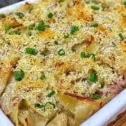 Homemade tuna noodle casserole made with wide egg noodles, tuna, peas and a creamy white cheddar sauce, topped with crispy golden Parmesan Panko breadcrumbs and fresh chopped chives.